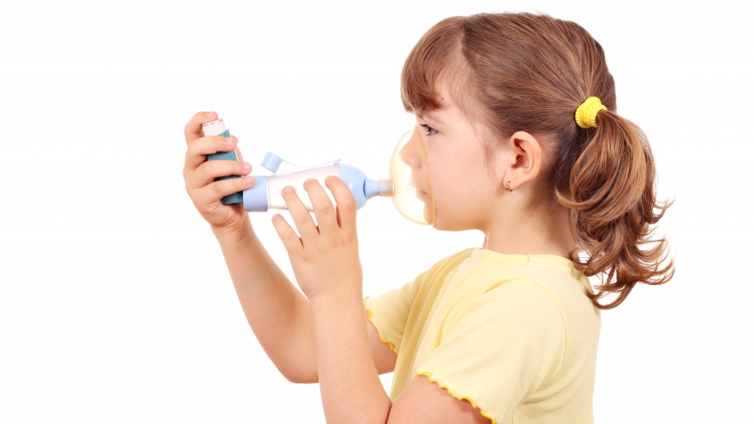 Little girl with asthma inhaler