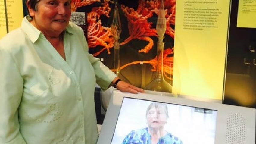 Elisabeth Ehrlich standing by the interactive display in the museum
