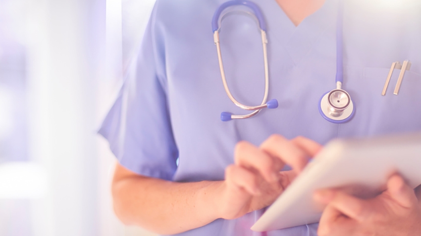 Image of a healthcare professional using a tablet